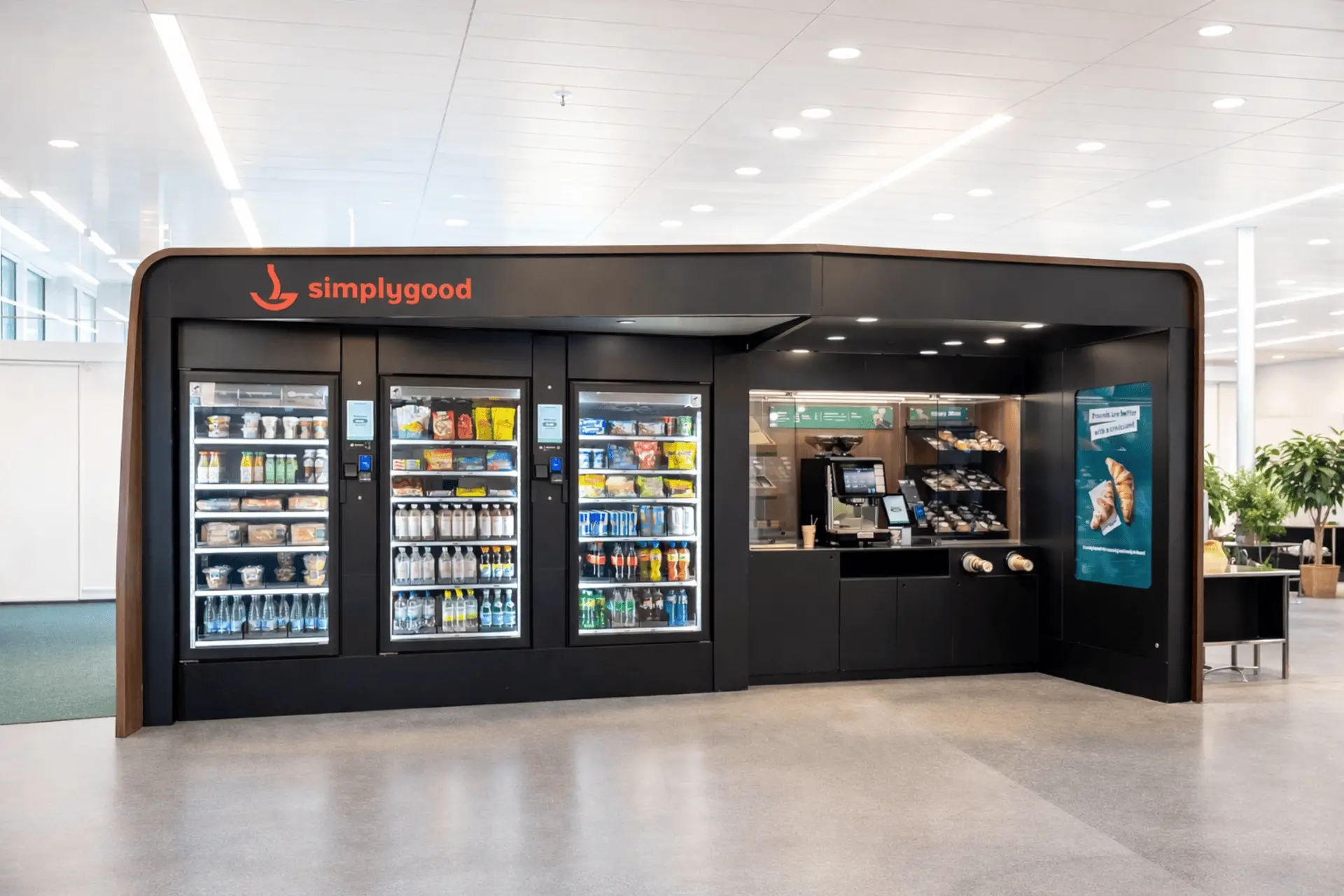 Simplygood urejeni kotiček s kavnim avtomatom, hladilniki in prigrizki v poslovni stavbi